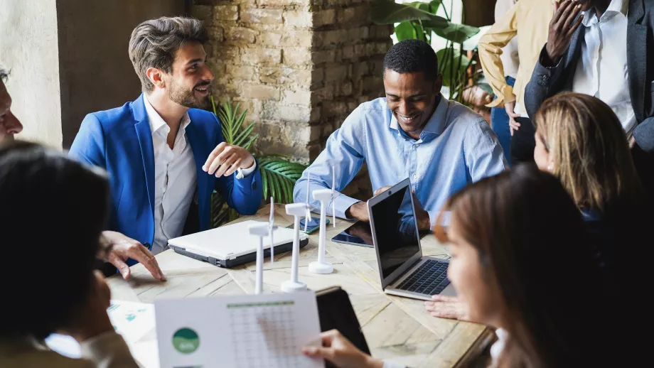 MBA students chat around a table